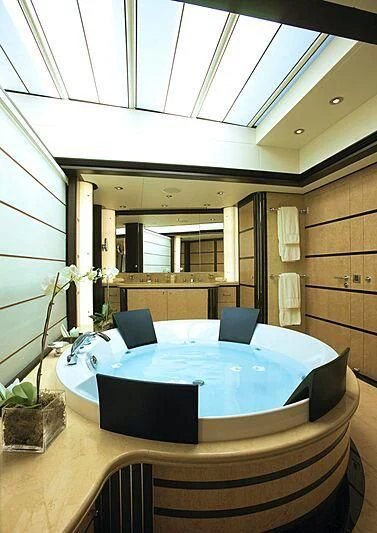 a room with a table and chairs aboard HARLE Yacht for Sale