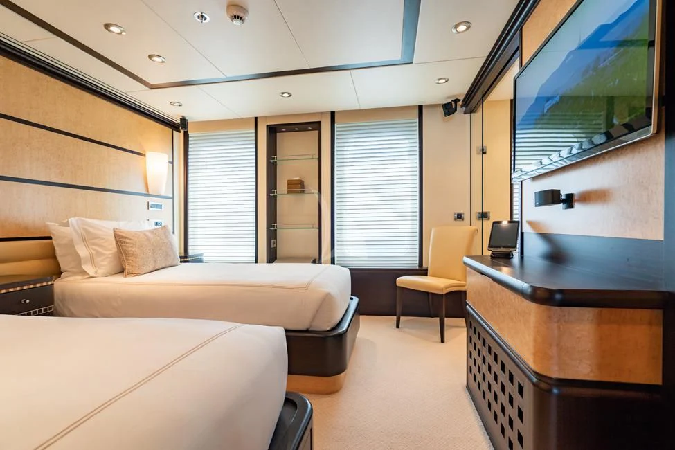 a room with a bed and a desk aboard HARLE Yacht for Sale