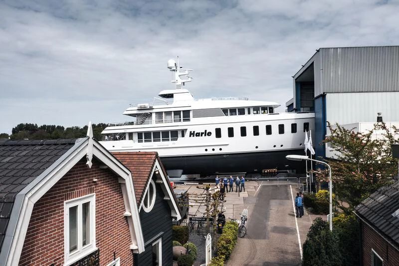 a large white ship docked aboard HARLE Yacht for Sale