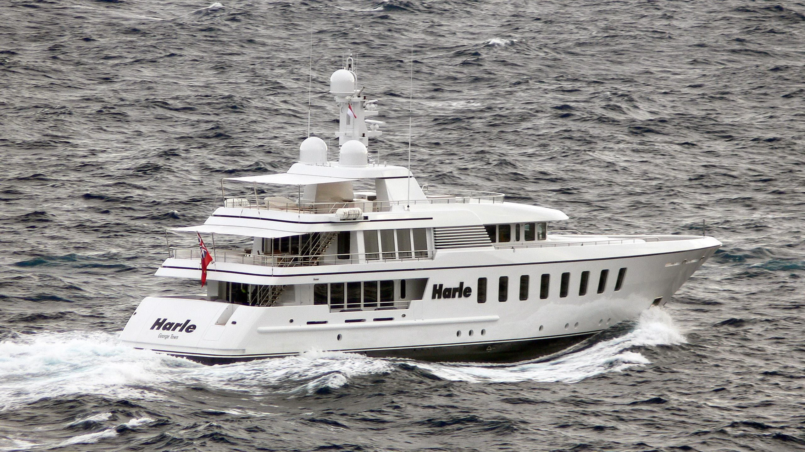 a white boat on the water aboard HARLE Yacht for Sale