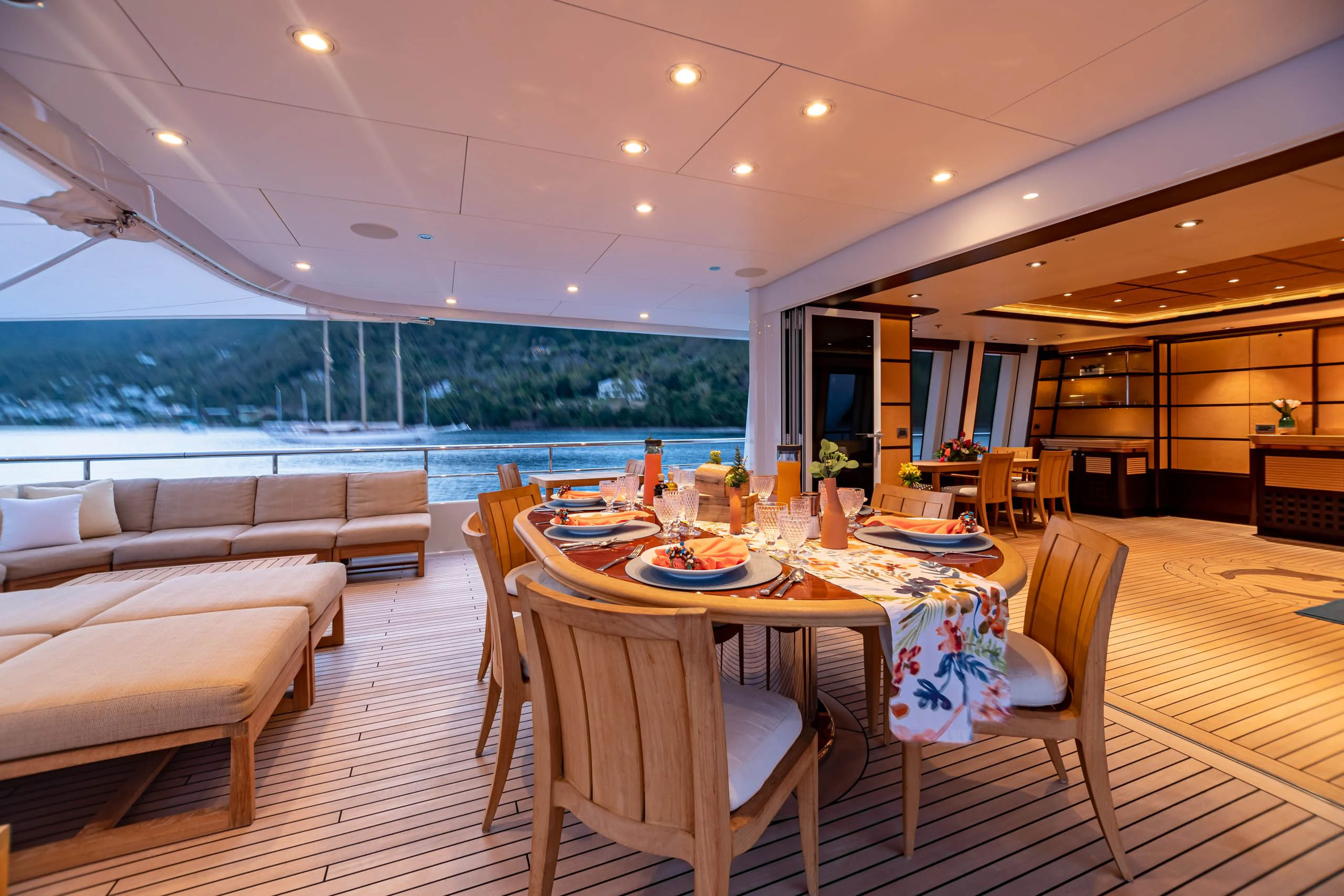 a dining room with a large patio aboard HARLE Yacht for Sale