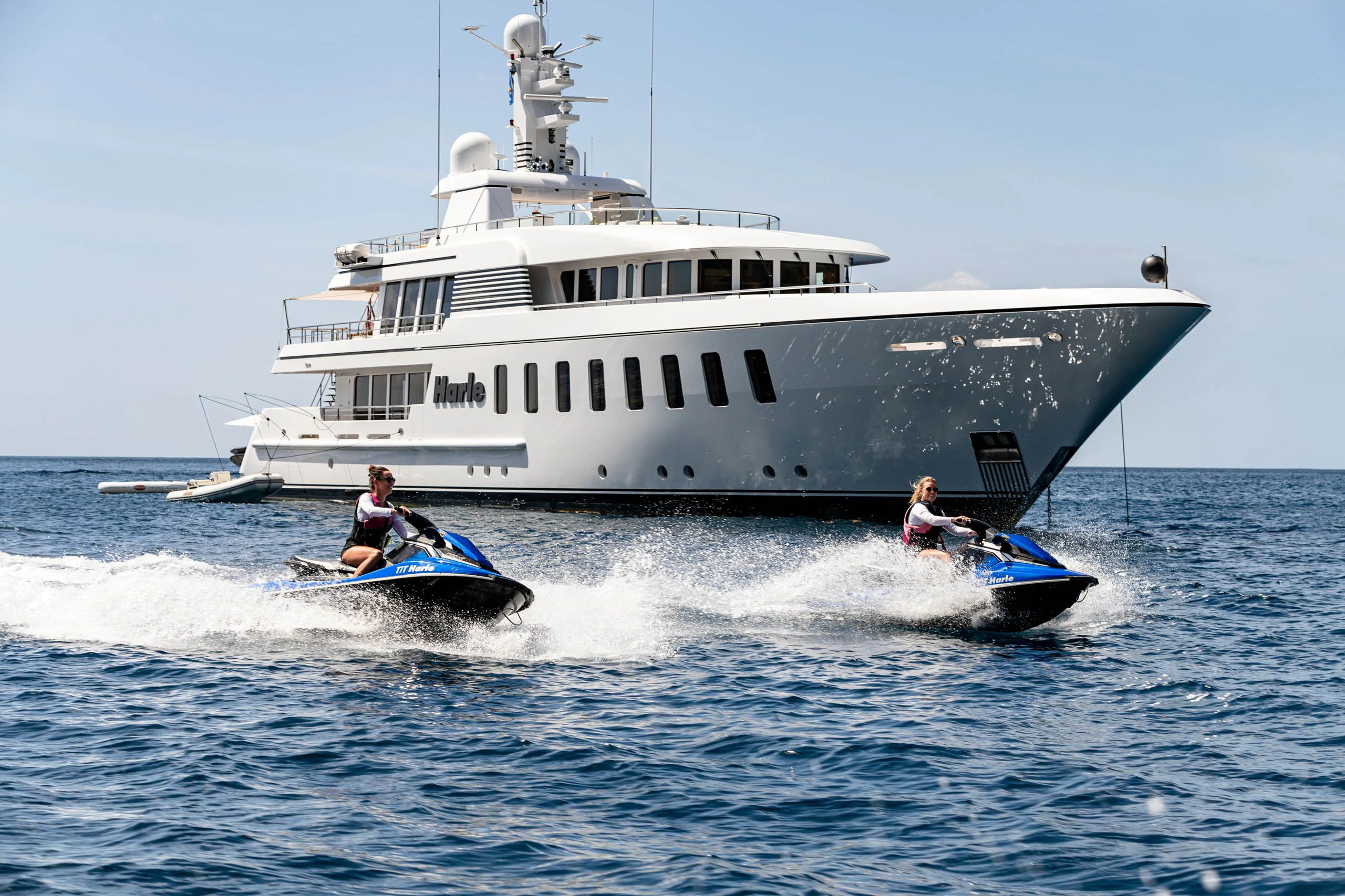 a boat with a couple of people in it aboard HARLE Yacht for Sale