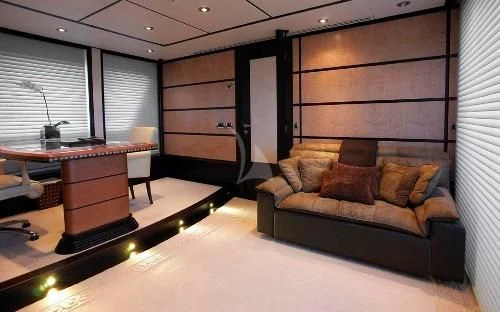 a living room with a couch and a table aboard HARLE Yacht for Sale