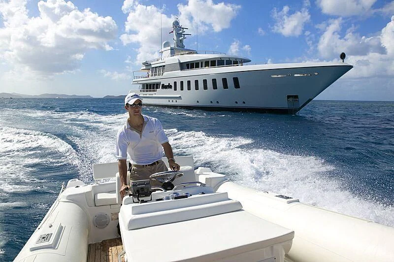 a man on a boat aboard HARLE Yacht for Sale