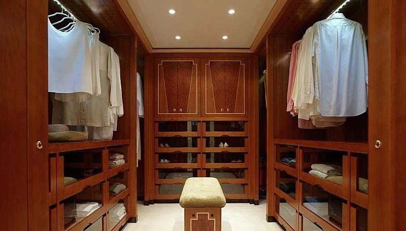 a room with wooden cabinets aboard LADY CHRISTINE Yacht for Sale