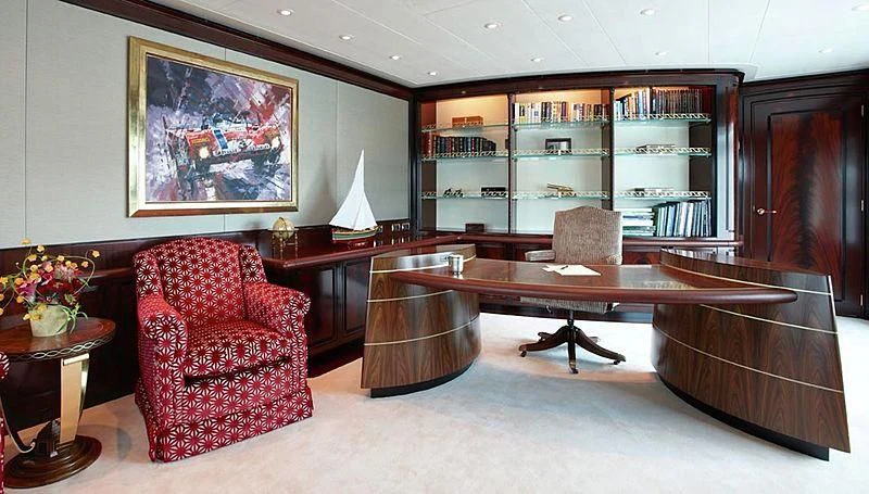 a room with a table chairs and a bench aboard LADY CHRISTINE Yacht for Sale