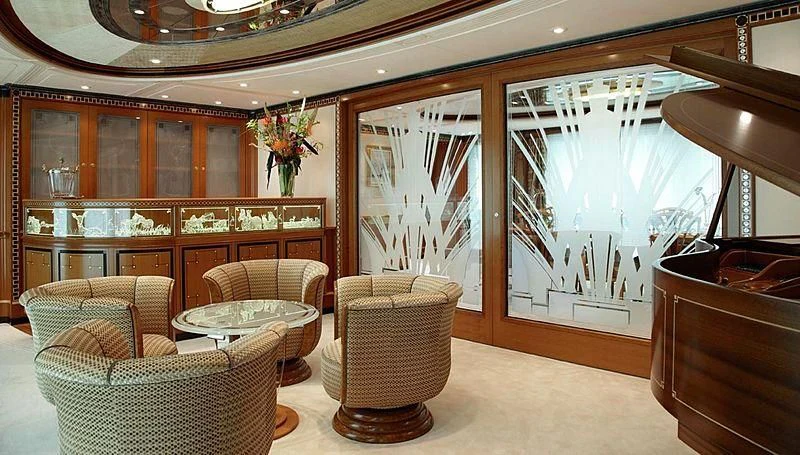 a room with a large fireplace aboard LADY CHRISTINE Yacht for Sale