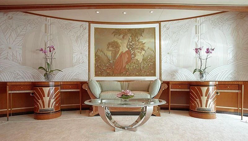 a room with a couch and a table and a chair aboard LADY CHRISTINE Yacht for Sale