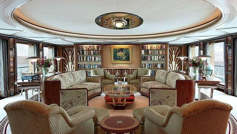 a living room with a large mirror aboard LADY CHRISTINE Yacht for Sale