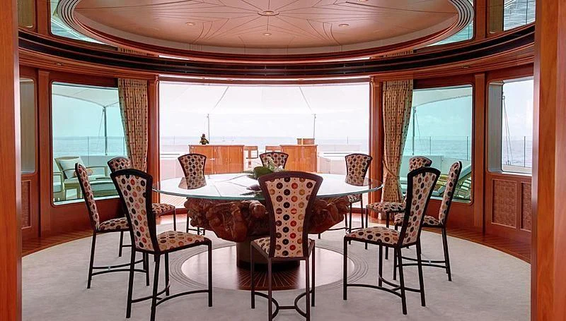 a dining room with a table and chairs aboard LADY CHRISTINE Yacht for Sale