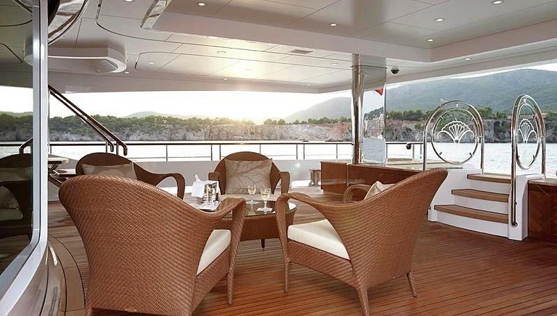 a room with chairs and tables aboard LADY CHRISTINE Yacht for Sale