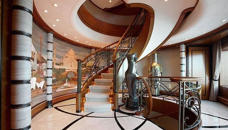 a large room with stairs and a staircase aboard LADY CHRISTINE Yacht for Sale