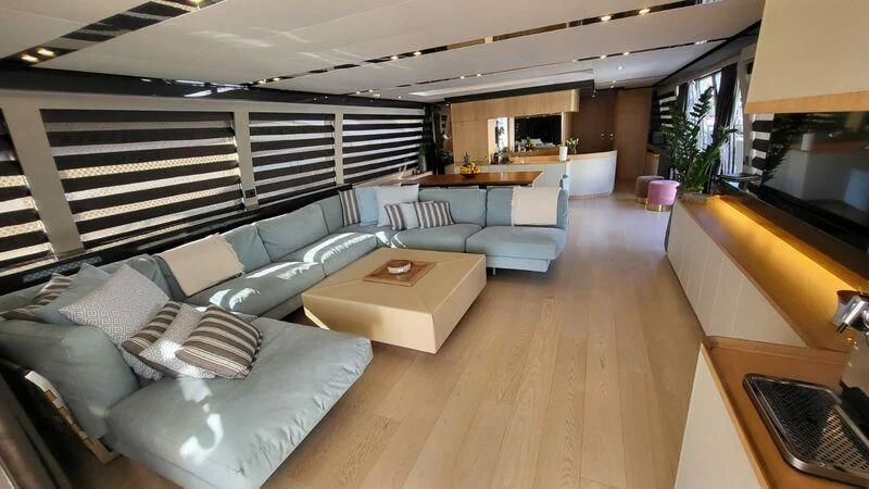 a living room with a couch and a table aboard KATARIINA XO Yacht for Sale