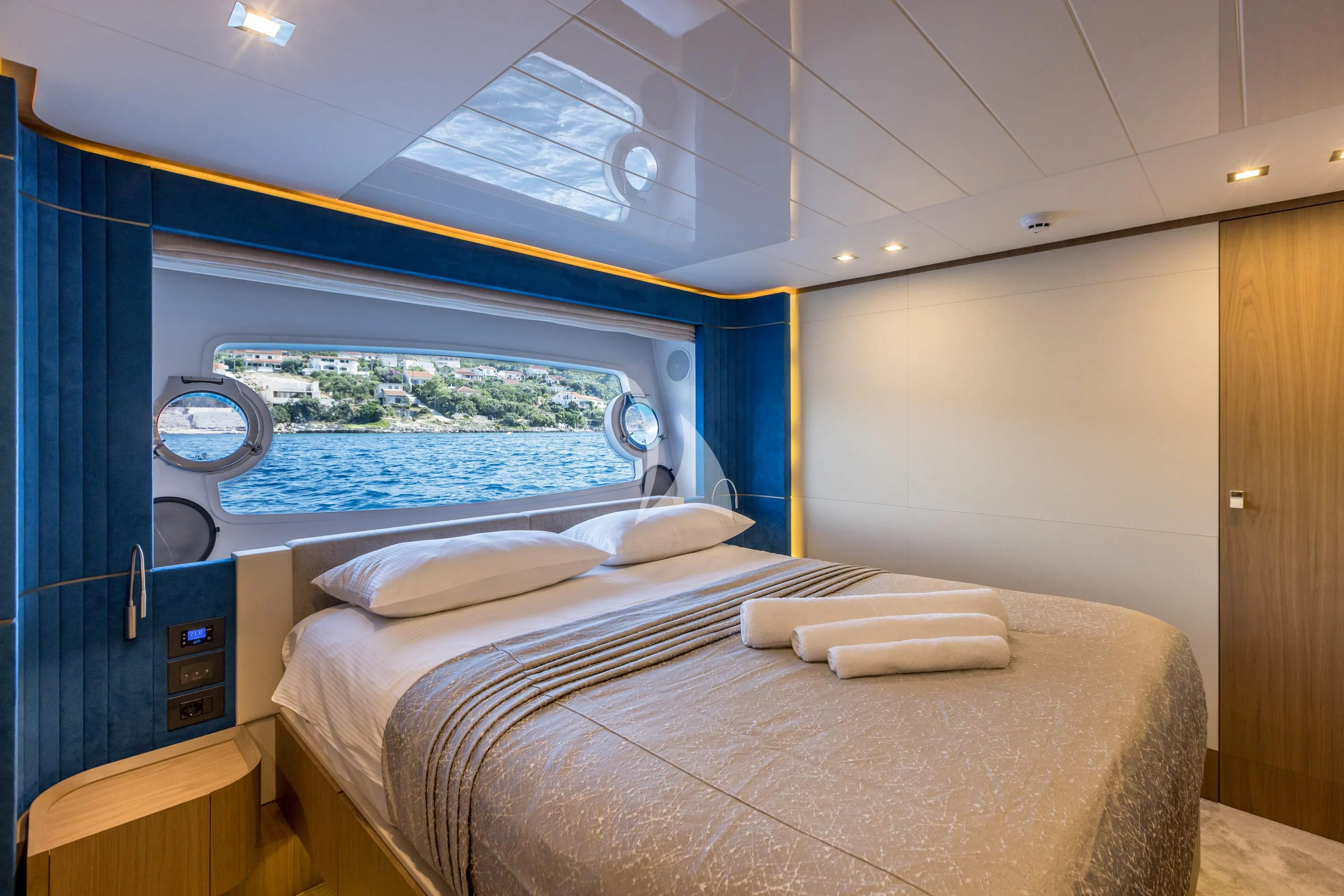 a room with a bed and a window aboard KATARIINA XO Yacht for Sale