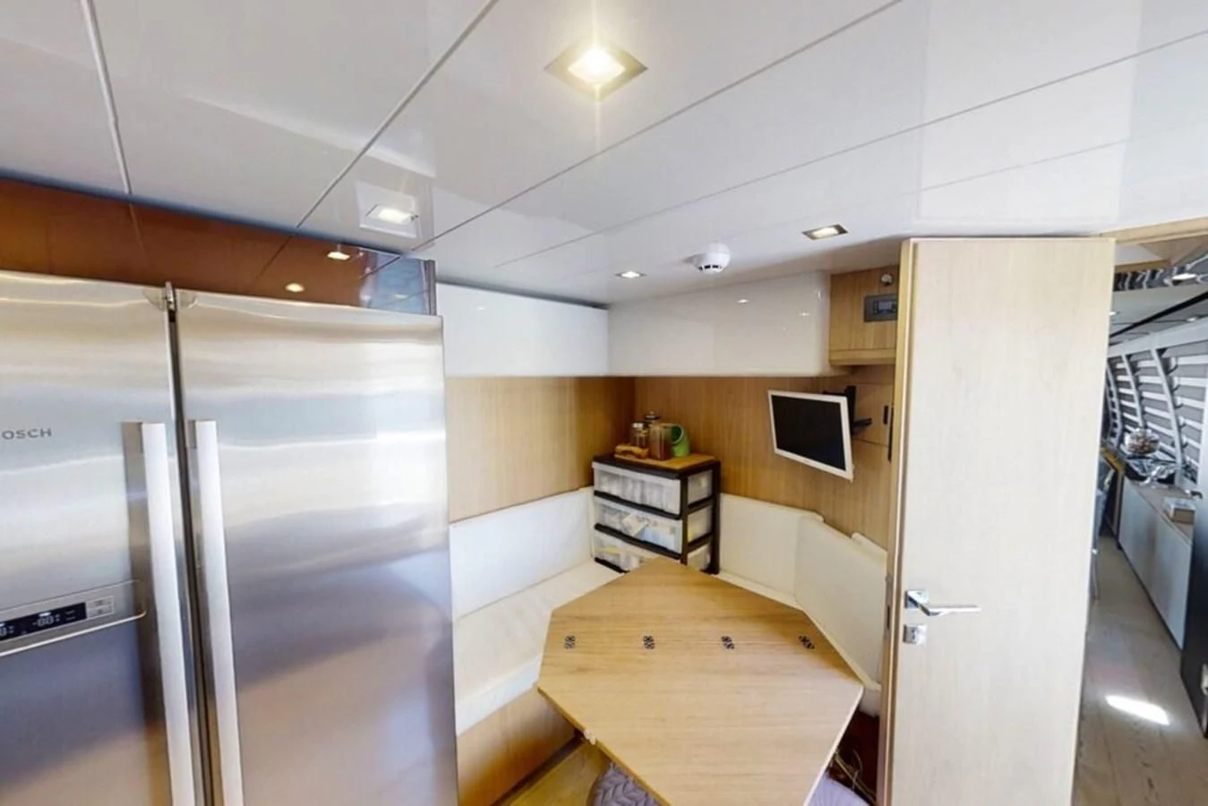 a room with a desk and a computer on a table aboard KATARIINA XO Yacht for Sale