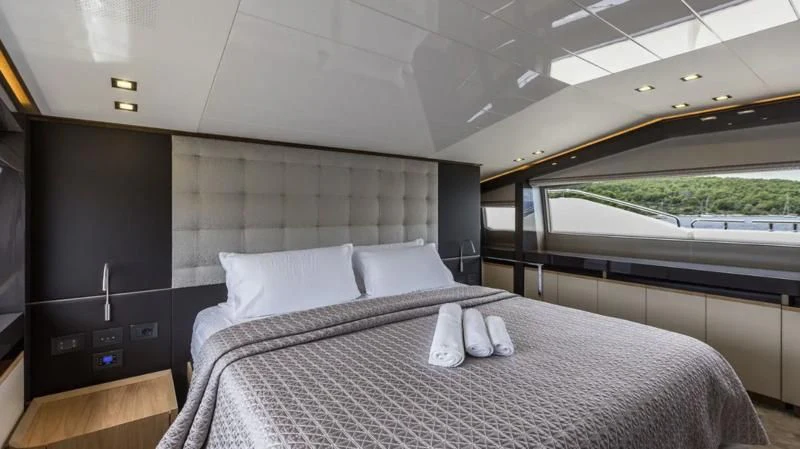 a bed in a room aboard KATARIINA XO Yacht for Sale
