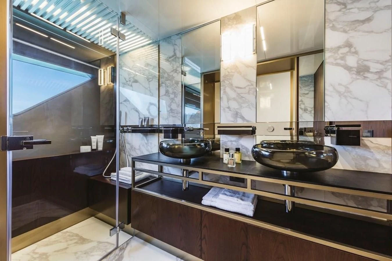 a kitchen with a sink and a mirror aboard KATARIINA XO Yacht for Sale