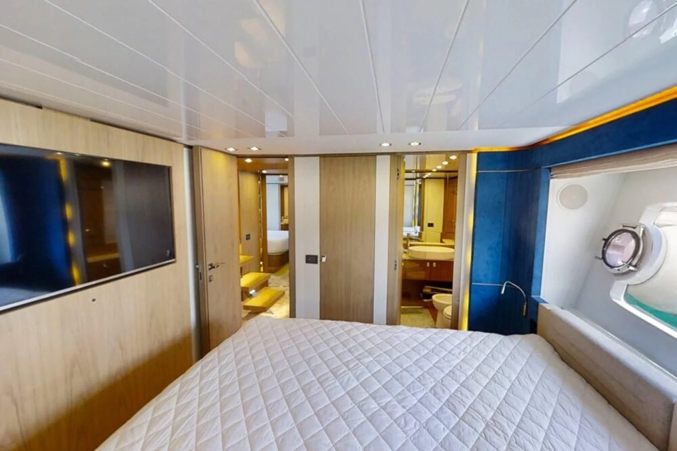 a room with a bed and a mirror aboard KATARIINA XO Yacht for Sale