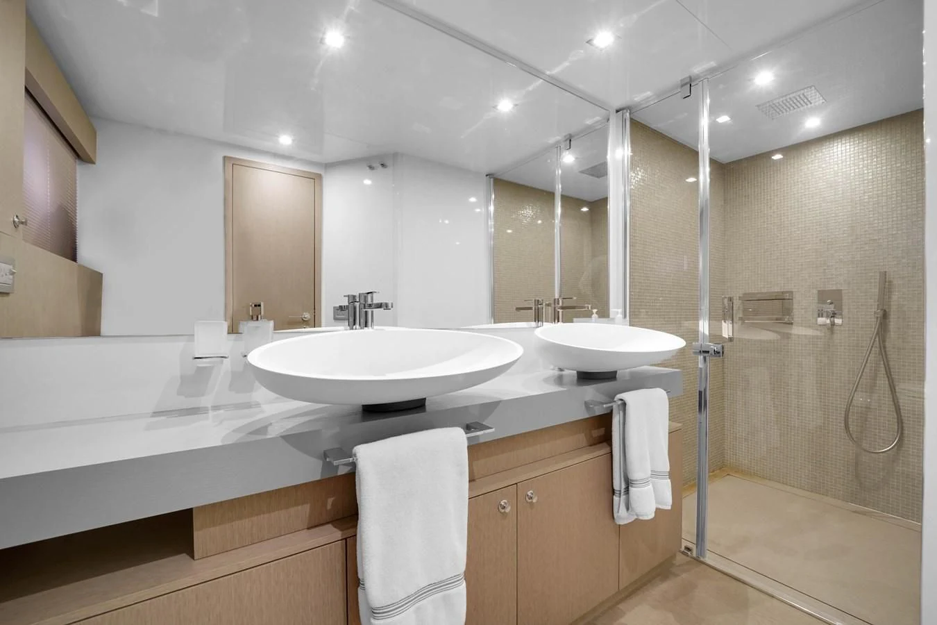 a bathroom with a large mirror aboard KATARIINA XO Yacht for Sale