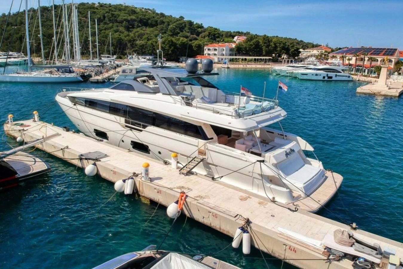 a boat docked at a pier aboard KATARIINA XO Yacht for Sale