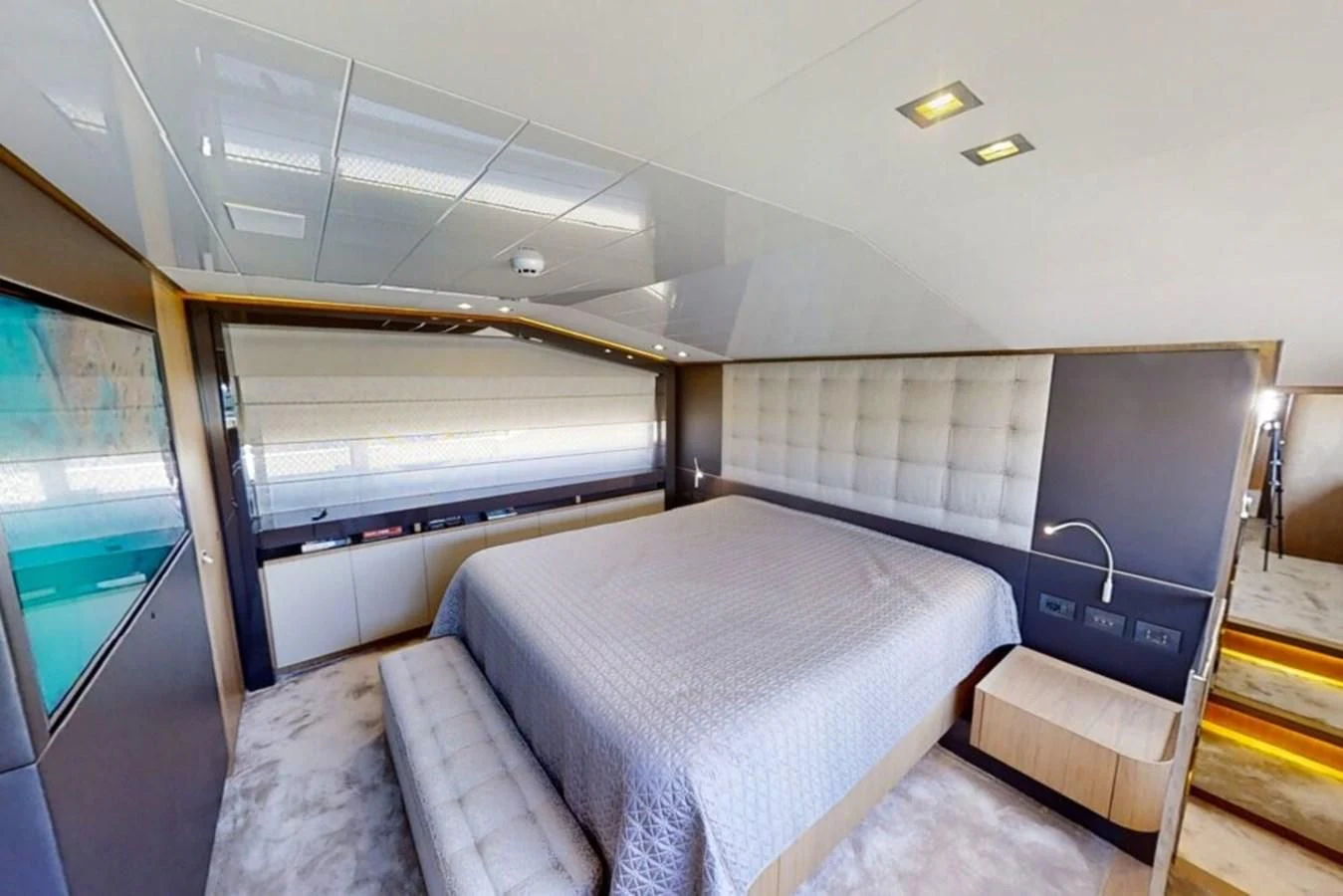 a room with a bed and a window aboard KATARIINA XO Yacht for Sale