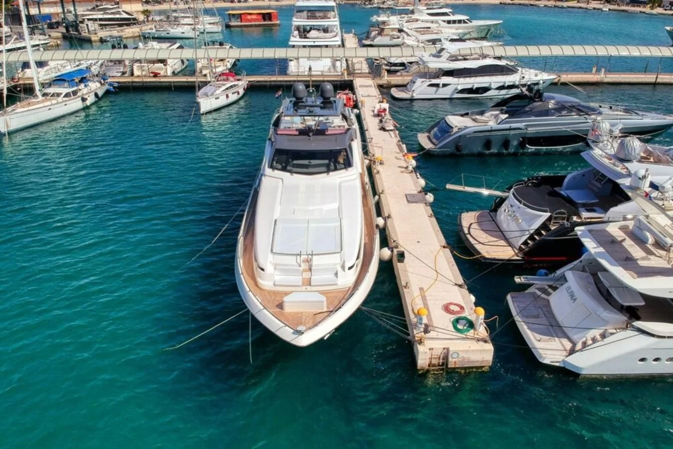 a group of boats are parked in a harbor aboard KATARIINA XO Yacht for Sale