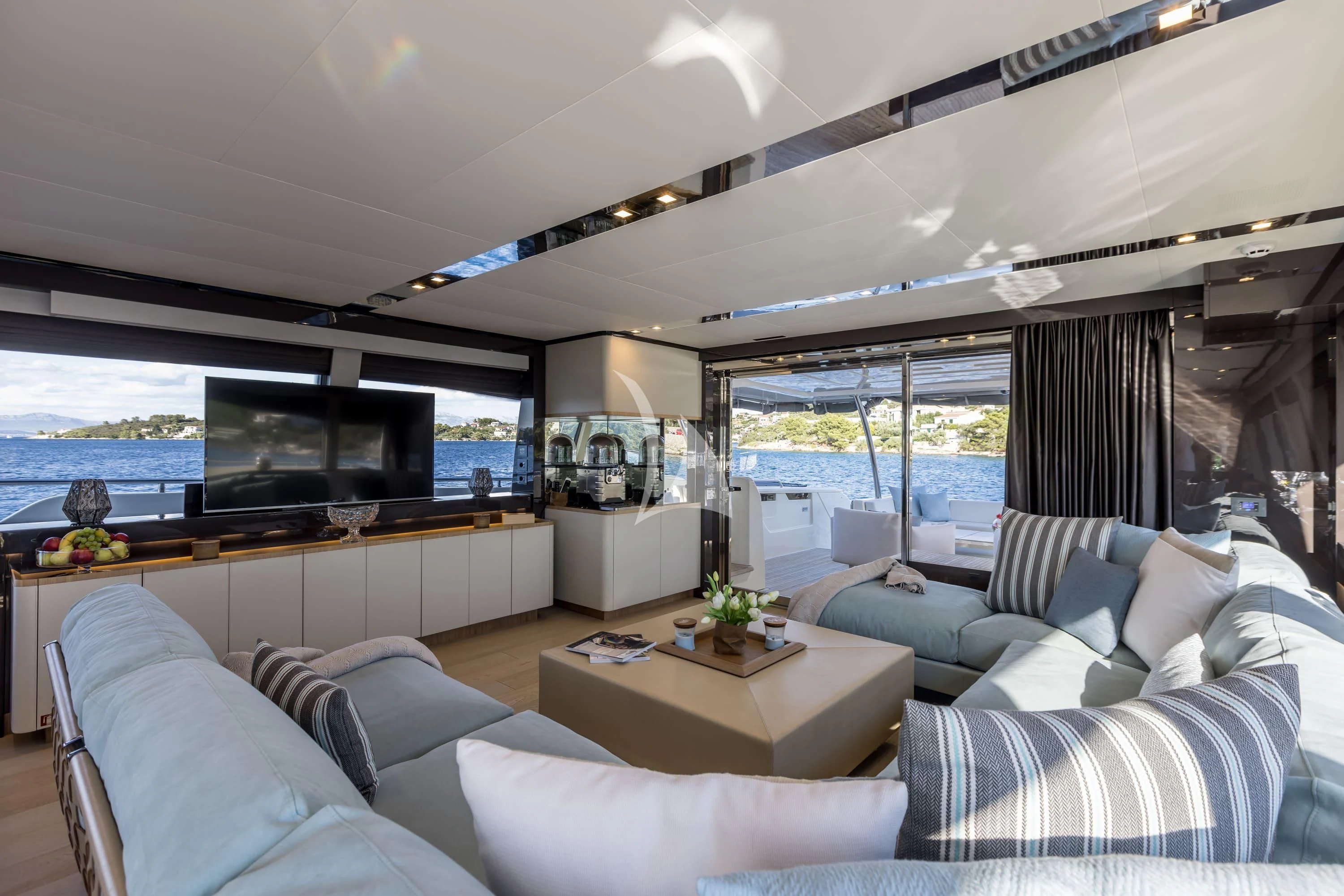 a living room with a large window aboard KATARIINA XO Yacht for Sale