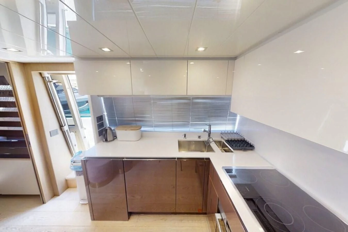 a kitchen with a sink and a stove aboard KATARIINA XO Yacht for Sale