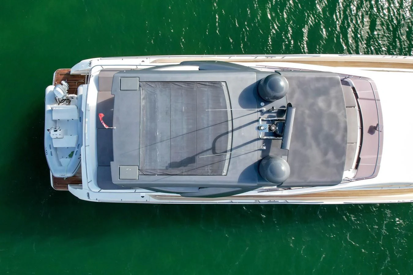 a white and black vehicle aboard KATARIINA XO Yacht for Sale