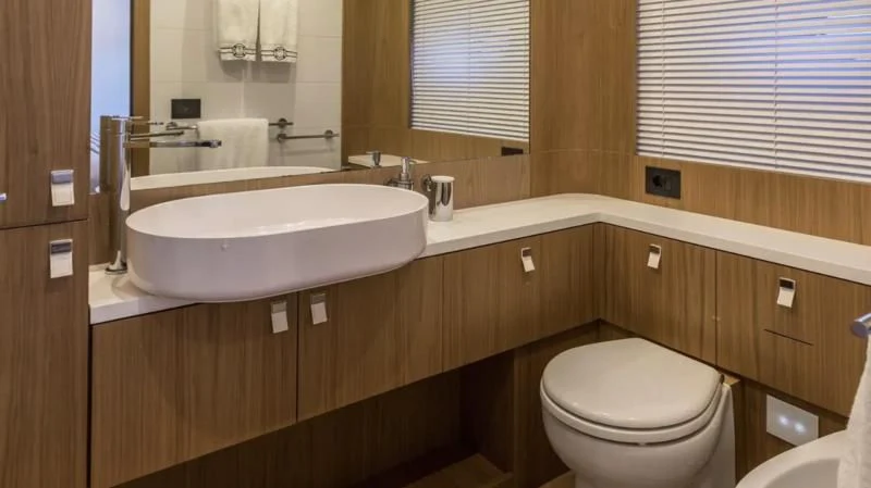 a bathroom with a sink and toilet aboard KATARIINA XO Yacht for Sale