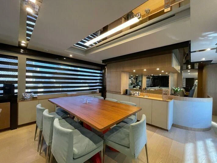 a kitchen with a table and chairs aboard KATARIINA XO Yacht for Sale