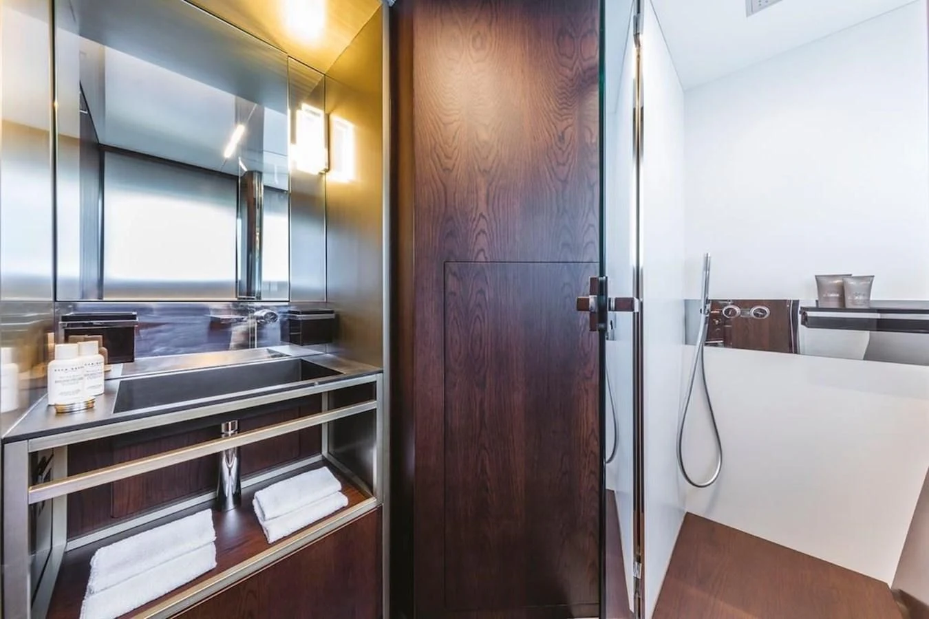 a kitchen with a wood door aboard KATARIINA XO Yacht for Sale