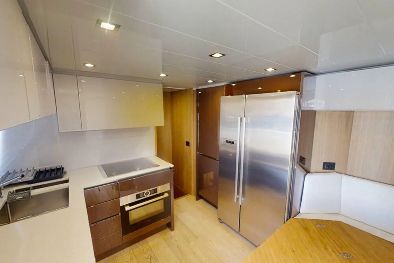 a kitchen with a refrigerator and a stove aboard KATARIINA XO Yacht for Sale
