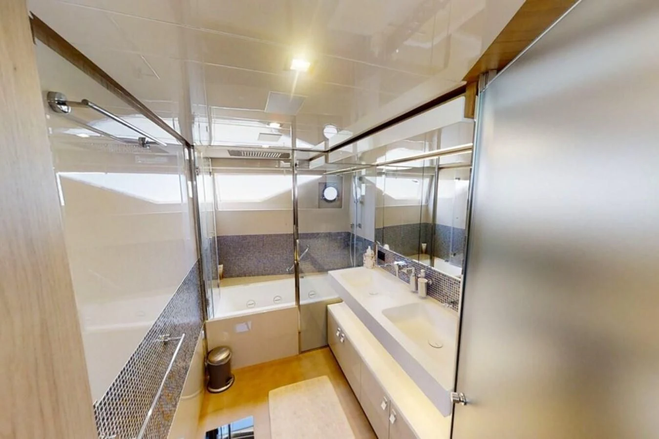 a bathroom with a large mirror aboard KATARIINA XO Yacht for Sale