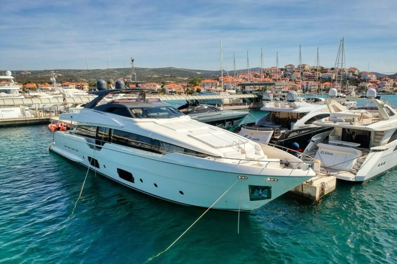 a group of boats are parked in a harbor aboard KATARIINA XO Yacht for Sale