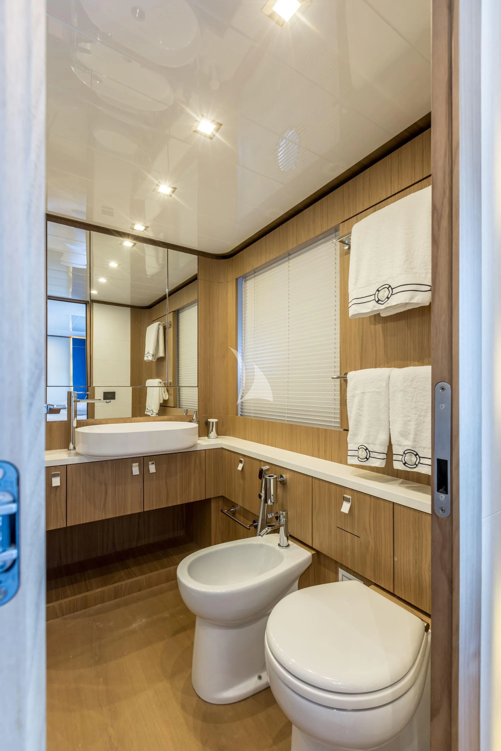a bathroom with a toilet and sink aboard KATARIINA XO Yacht for Sale