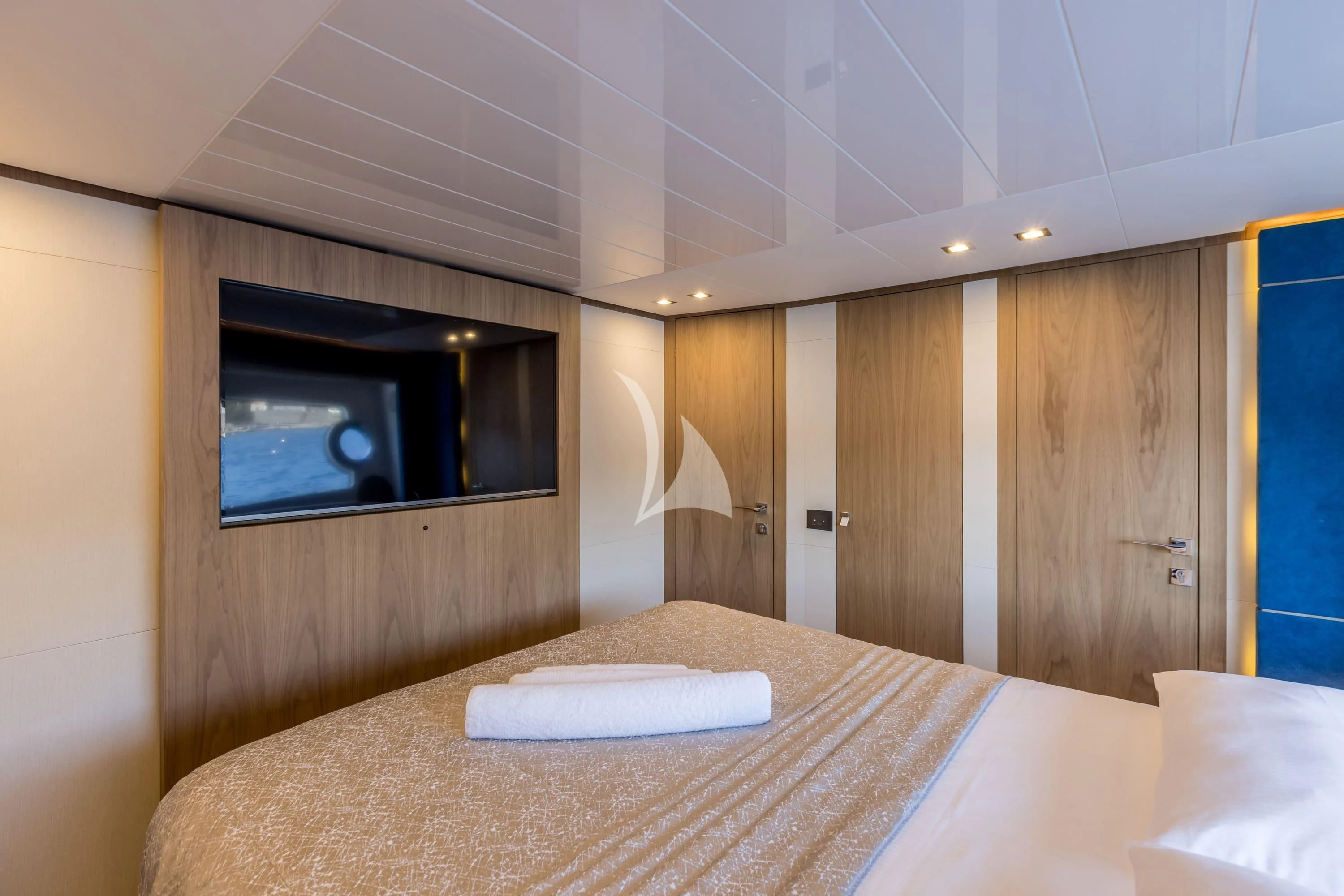 a room with a bed and a television aboard KATARIINA XO Yacht for Sale