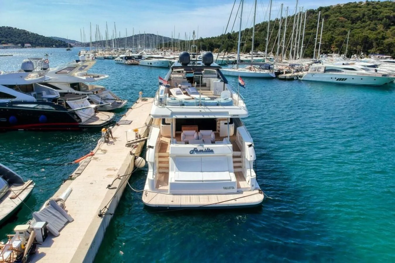 a boat docked at a pier aboard KATARIINA XO Yacht for Sale