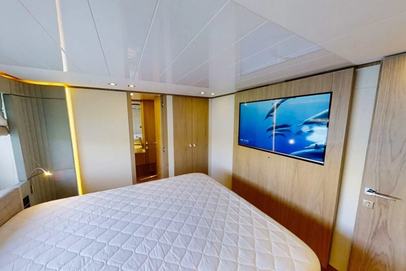 a bed with a blue screen aboard KATARIINA XO Yacht for Sale