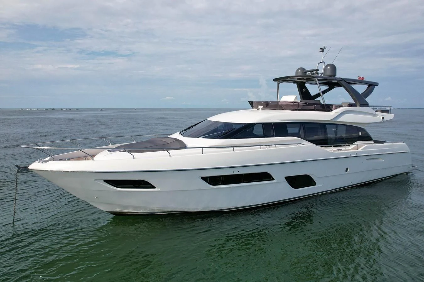 a white yacht in the water aboard KATARIINA XO Yacht for Sale