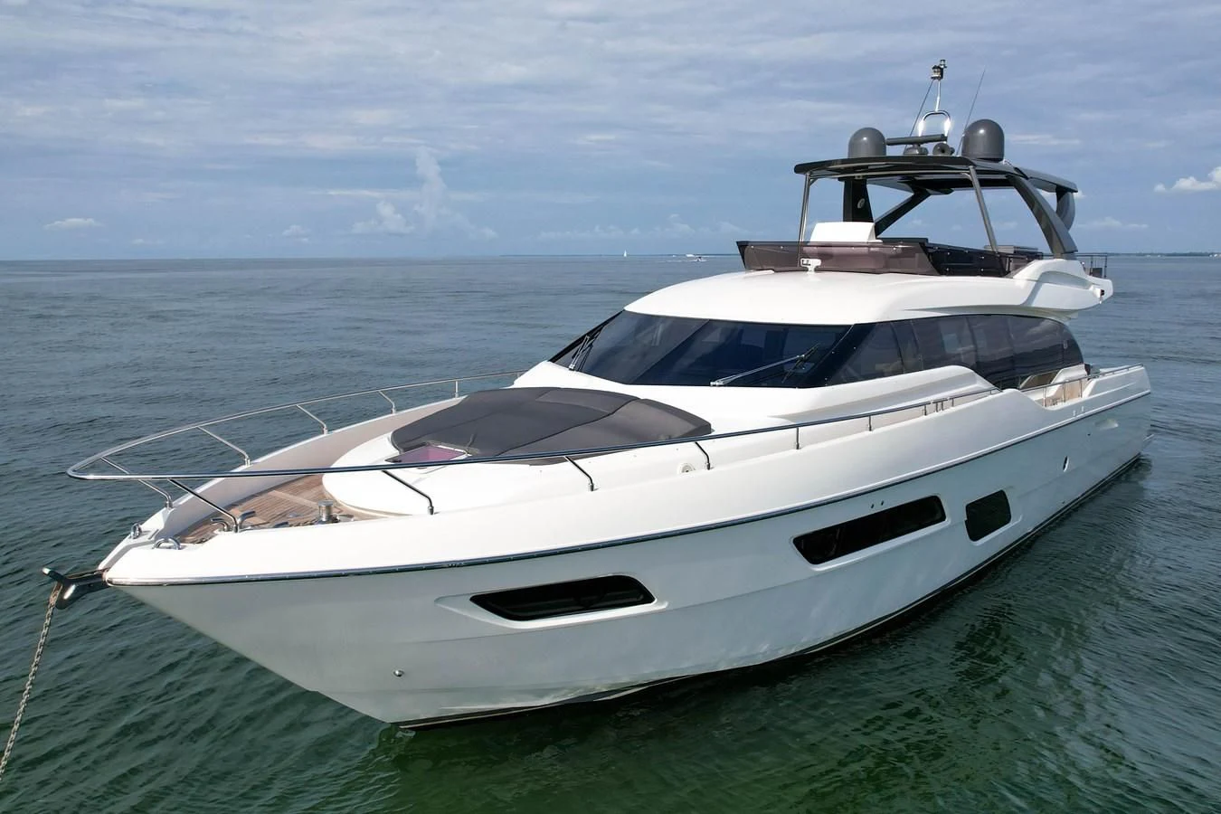 a white yacht in the water aboard KATARIINA XO Yacht for Sale