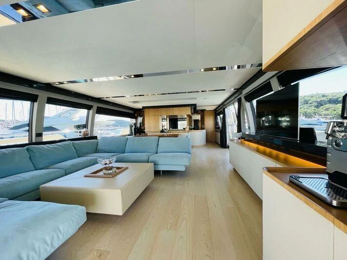 a living room with a large window aboard KATARIINA XO Yacht for Sale