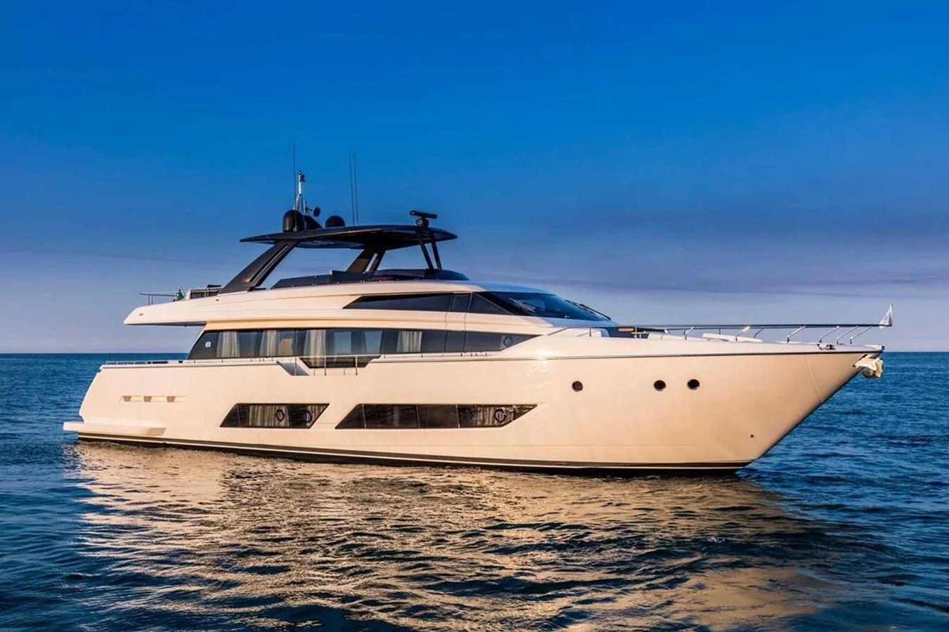a white yacht in the water aboard KATARIINA XO Yacht for Sale