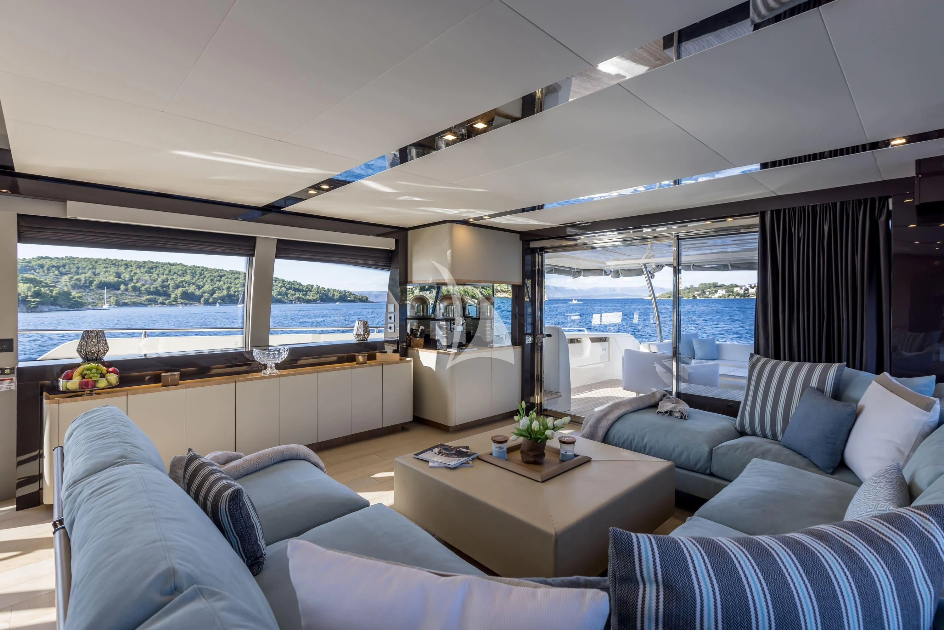 a living room with a large window aboard KATARIINA XO Yacht for Sale