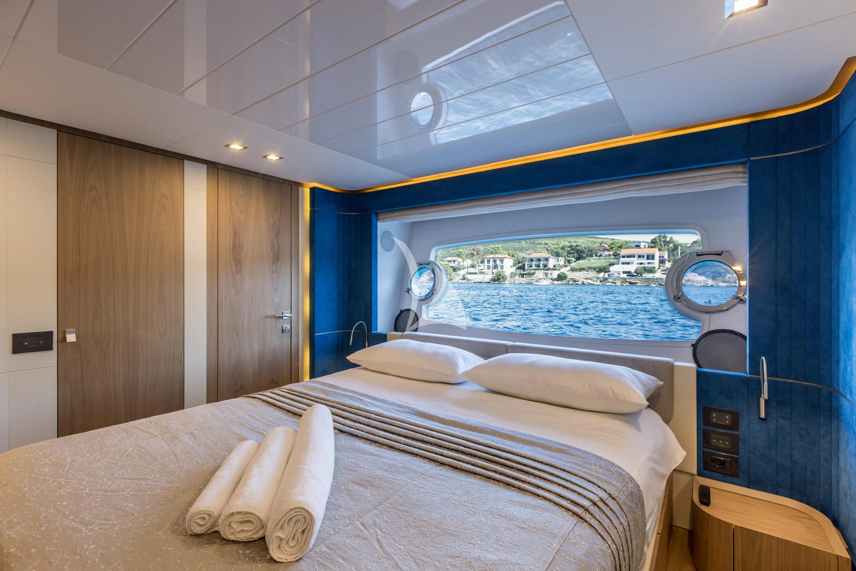 a room with a bed and a window aboard KATARIINA XO Yacht for Sale