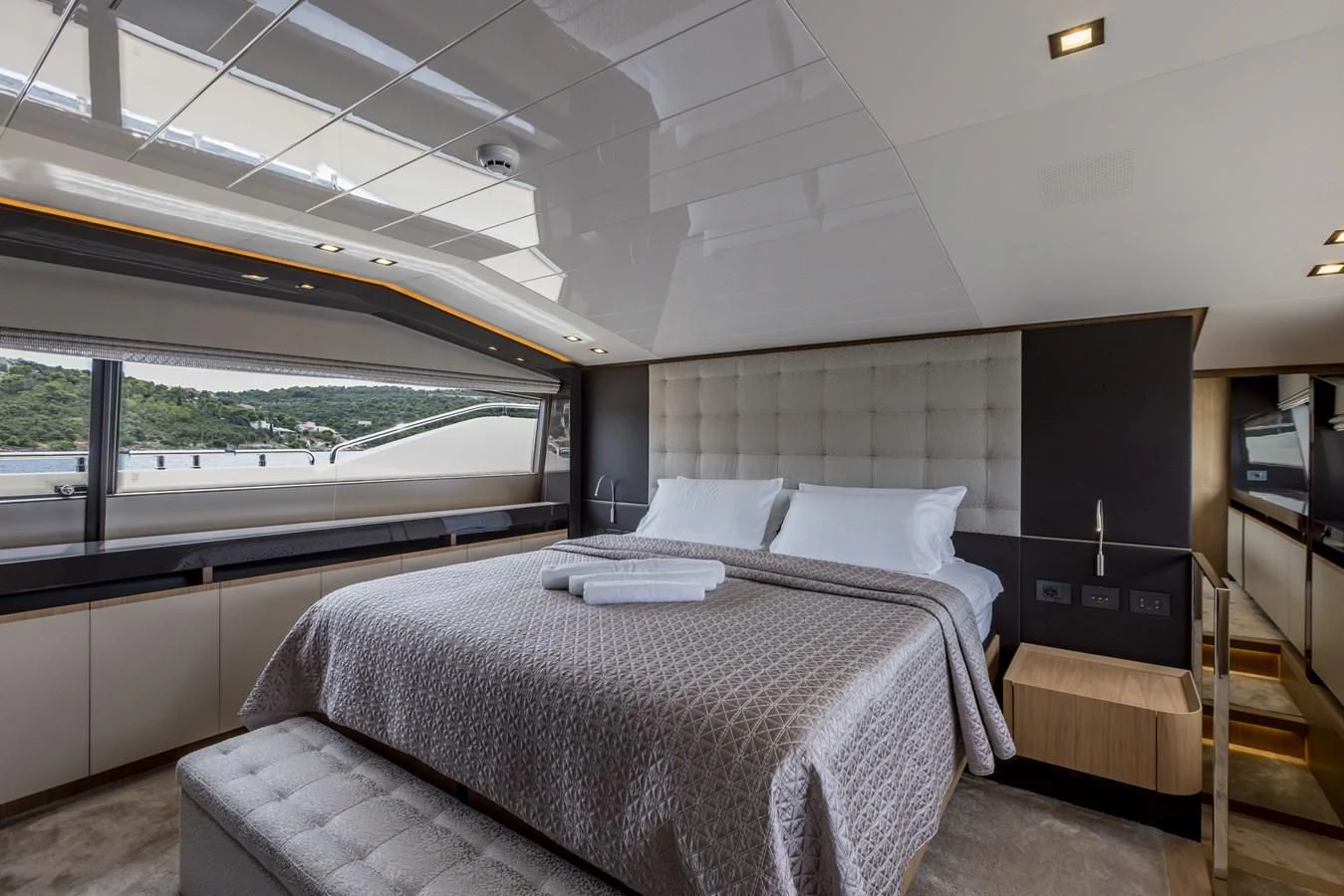a room with a bed and a window aboard KATARIINA XO Yacht for Sale