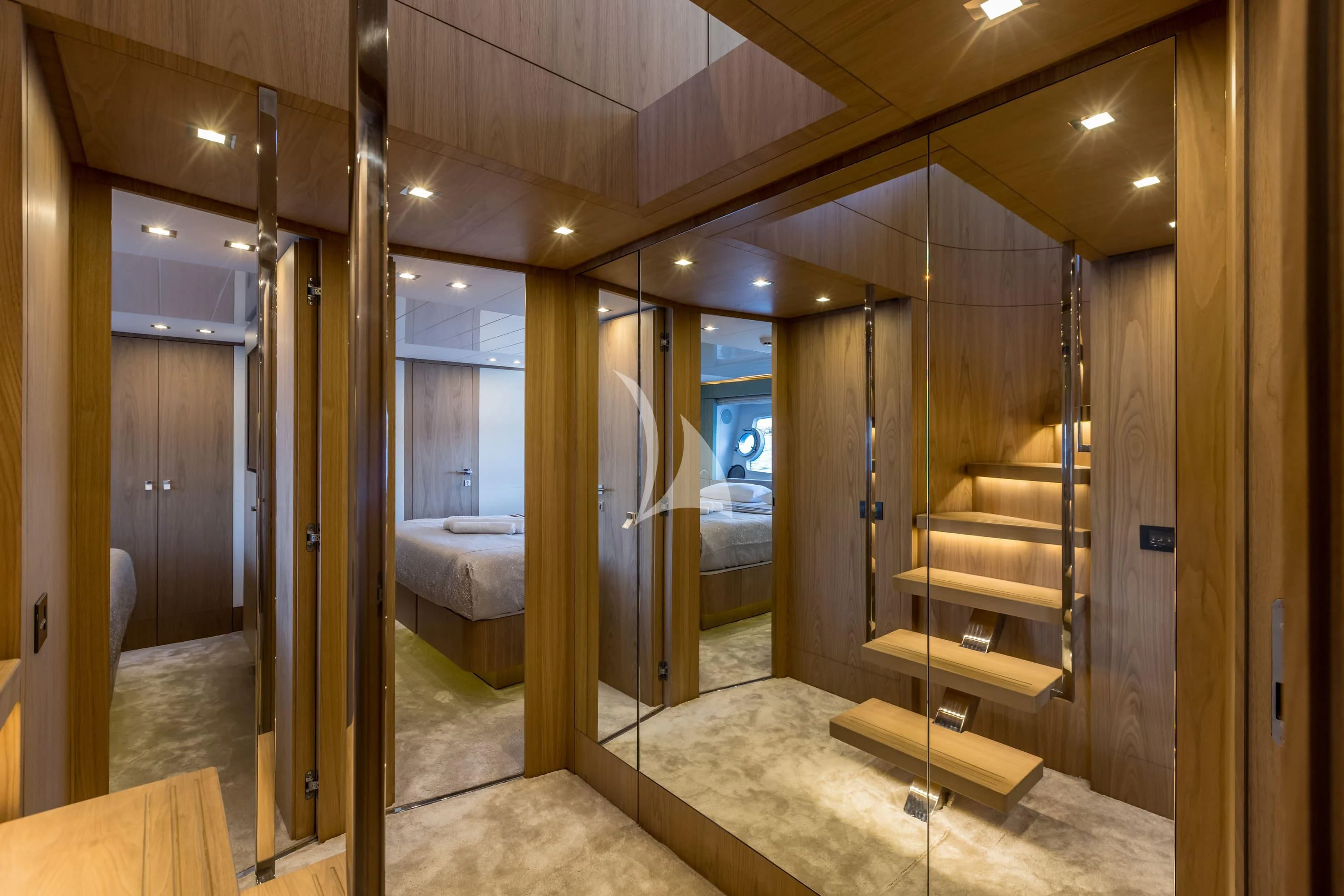 a room with a bed and a large mirror aboard KATARIINA XO Yacht for Sale