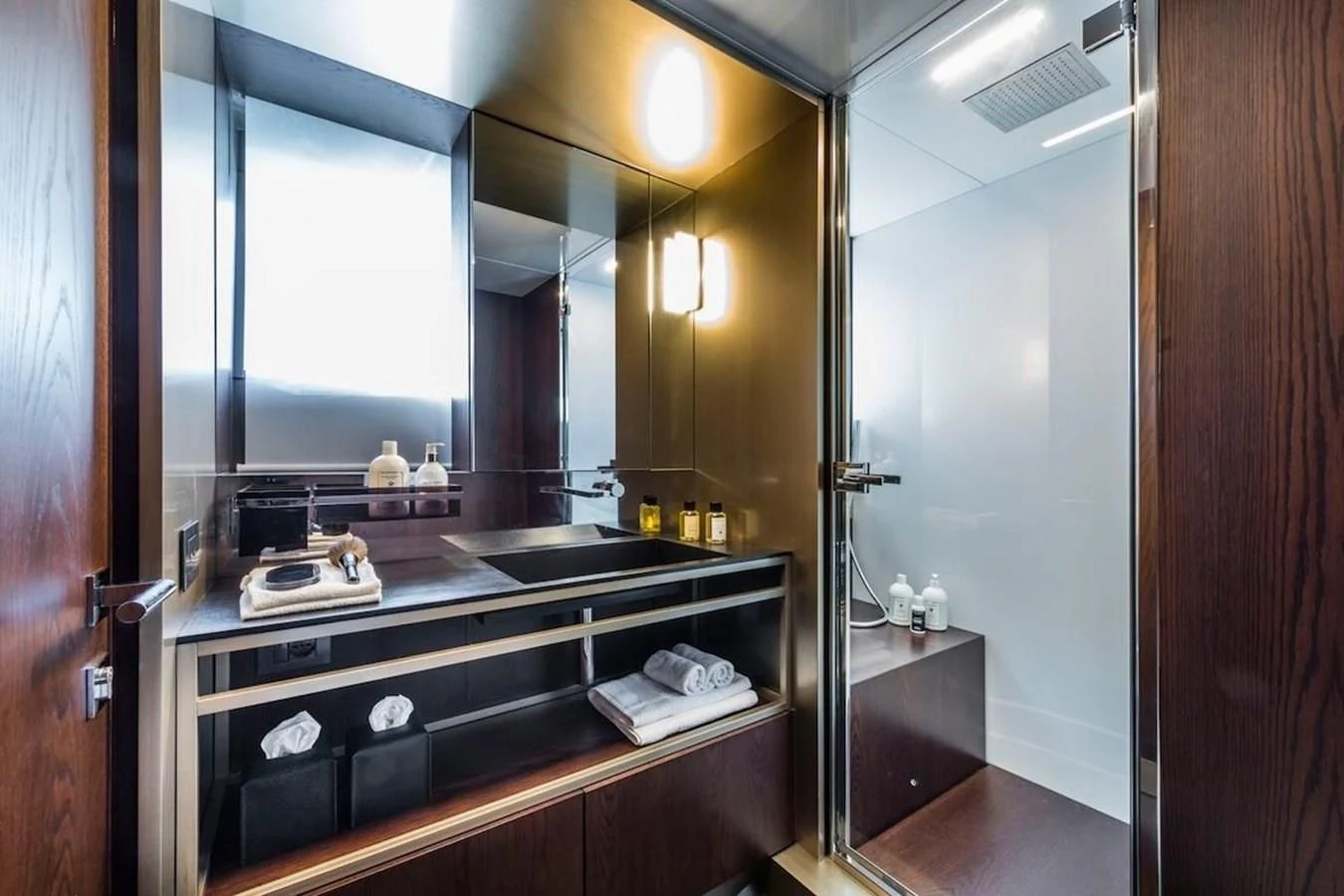 a bathroom with a large mirror aboard KATARIINA XO Yacht for Sale