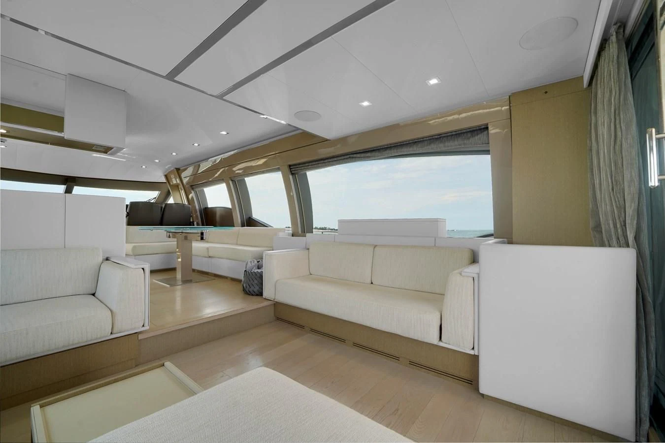 a living room with white couches aboard KATARIINA XO Yacht for Sale