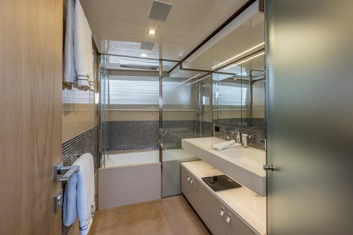 a bathroom with a large mirror aboard KATARIINA XO Yacht for Sale